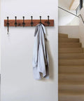 Built Dang Tough Rustic Cast Iron Wall Hooks Heavy Duty Farmhouse Coat Hangers Durable Vintage Hanging Hardware Set Of Five mounted on a wall with a grey coat.