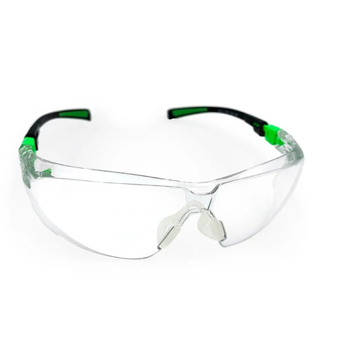 Rock Solid Pair Of Uv Shielding Safety Glasses With Anti Fog Scratch Proof Wraparound Lenses Perfect For Work Sports Yard Chores Or Driving Featuring Ansi Z871 Standard Comfortable Nose Guard And Flexible Temples For Daily Driver in clear poly lens with green accents.