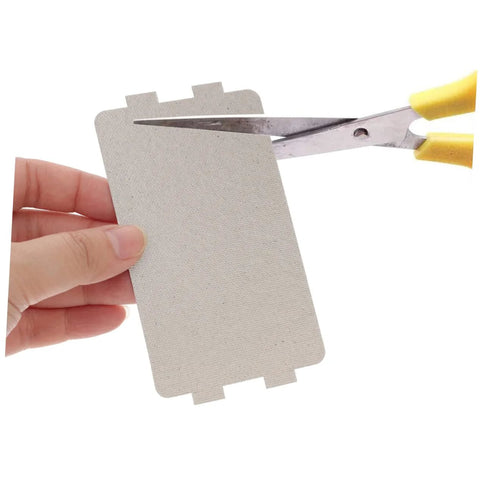 Cutting Six Pack Microwave Waveguide Covers And Heat Insulation Pads with scissors
