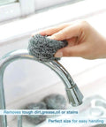 Heavy Duty Stainless Steel Scrubber Pads For Tough Kitchen Scrubbing On Dishes Pots Pans Ovens Grills And Sinks Ergonomic 2.4 Inch Diameter Durable Spiral Wire That Will Not Rust Or Fray 12 Pack For Beat Grime Fast And Easy Cleanup in use