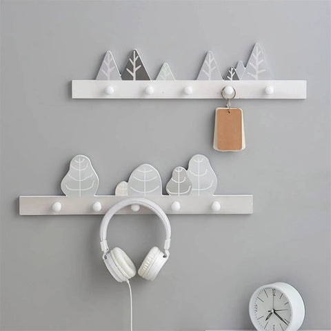 Solid Wooden Wall Mounted Coat Rack With Key Holder Smooth Black Finish Multi Purpose Entryway Organizer For Coats Hats Towels No Sweat Setup Straight Up Top Shelf Storage with decorative mountain and tree designs.