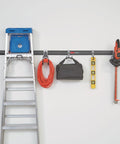 FastTrack Garage Storage Rail System 7 Piece Hook Kit Heavy Duty Tool Organizer installed with tools on wall