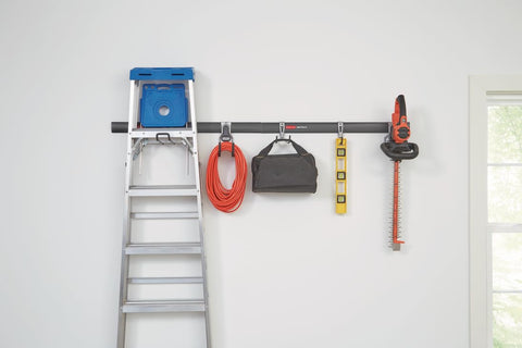 FastTrack Garage Storage Rail System 7 Piece Hook Kit Heavy Duty Tool Organizer installed with tools on wall
