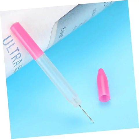 Precision Oiler Pen For Watch Repair And Clock Work Pro Grade Oil Tool with pink cap on blue surface