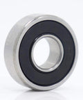 Top Rated 608 Hybrid Ceramic Ball Bearings for Skateboards And Scooters Featuring Si3N4 Balls For Smoother Spins With Low Friction And High Durability Perfect For Fast Motors And Industry Spindles At 9x22x7mm Size - Close-up of a sealed ceramic bearing.