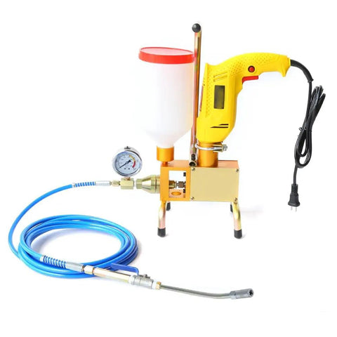 Electric greasing tool with yellow handle, pressure gauge, blue hose, and nozzle for industrial equipment lubrication.