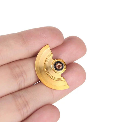 Gold Stainless Steel Automatic Hammer Oscillating Weight Watch Rotor for Precision Watch Repair held in hand.