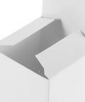 Close-up of square white cardboard box with buckle bottom for candles and jewelry packaging, part of set of 10 for small biz shipping.