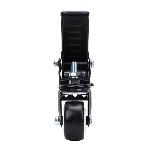 Hella Sturdy Workbench Casters Kit With Pedal Operated Lift Lower Mechanism Retractable 360 Degree Swivel Wheels Steel And Polyurethane Roller Pack 900 Pound Weight Limit For Home Benches front view of caster with pedal and black wheel