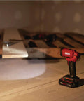 Ultra Bright Led Work Spotlight Rechargeable 20 Volt Cordless 300 Lumens Portable Jobsite Light 104 Degree Swivel Head on a work surface.
