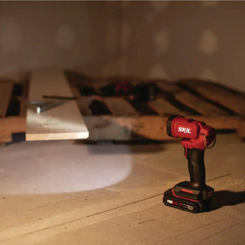 Ultra Bright Led Work Spotlight Rechargeable 20 Volt Cordless 300 Lumens Portable Jobsite Light 104 Degree Swivel Head on a work surface.