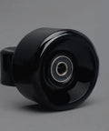 Close-up of black Premium PU Roller Skate Wheels With Bearings Replacement For Indoor Skating on various surfaces.