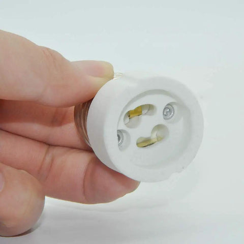 E26 E27 To GU10 Ceramic Socket Adapter Built Tough For Heavy Duty Halogen And Led Spotlight Work UL Certified 660 Watt, held in hand.