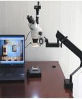 Professional Trinocular Stereo Zoom Microscope With Long Working Distance For Precision Inspection Of Circuits And Dental Appliances Includes 10x Wide Field Eyepieces For Clear Comfortable Viewing on clamping arm stand with laptop display