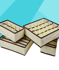 Fine Digs Non Woven Drawer Dividers For Bras And Underwear Plus Four Pack Closet Storage Bins in beige with brown trim.