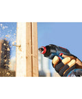 Bosch DSB1013 Daredevil spade bit in action on cordless drill drilling into wood, wood chips flying.