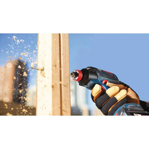 Bosch DSB1013 Daredevil spade bit in action on cordless drill drilling into wood, wood chips flying.