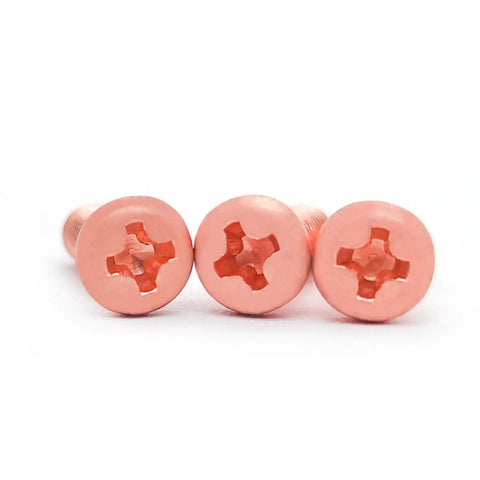 Close-up of Heavy Duty Pure Copper Phillips Head Cross Recessed Machine Screws Number 10 Thirty Two By Eight Millimeter Long.