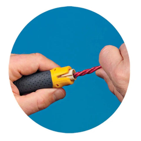 Hand using Lil Ripper Wire Stripper With Slitting Blade, V-Notch And Flat Blade Clip for NM cable stripping against blue background