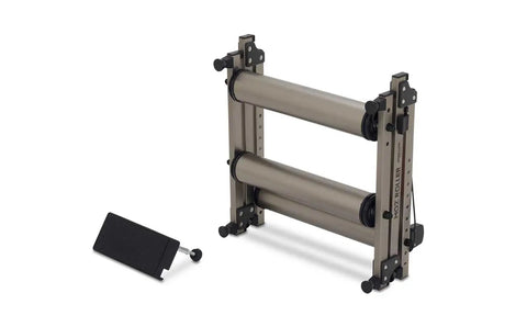 G2 Folding Bike Trainer with step guard, alloy rollers, compact 3-section fold design, showing adjustable rear roller for bikes