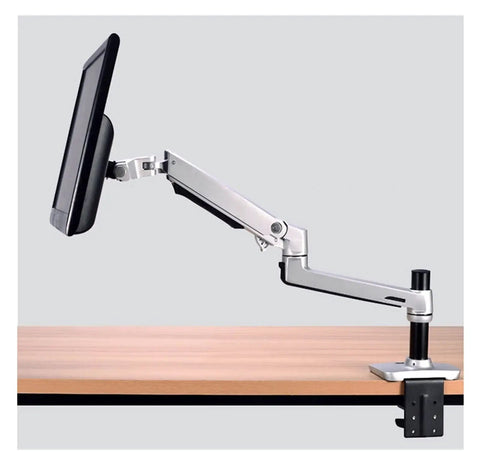 Slick Aluminum Desktop Clamp Monitor Mount For 17 To 32 Inch Screens With Smooth Full Motion Spring Arm on a desk.
