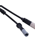 Two brake pad wear sensor cables with black insulation and beige/gray connectors; BMW-compatible close-up