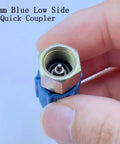 13mm Blue Low Side Quick Coupler for R12 To R134A AC Retrofit Fitting Adapter Kit shown in hand for size reference.