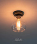 Industrial Black Semi Flush Mount Ceiling Light With Clear Glass Shade For Hallways Kitchens Dining Rooms And Entryways Dimmable With A Compatible Dimmer Switch And Easy Bulb Replacement For A Cool Industrial Vibe glowing bulb view
