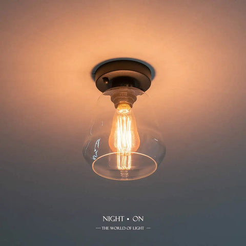 Industrial Black Semi Flush Mount Ceiling Light With Clear Glass Shade For Hallways Kitchens Dining Rooms And Entryways Dimmable With A Compatible Dimmer Switch And Easy Bulb Replacement For A Cool Industrial Vibe glowing bulb view