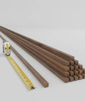 Top Shelf Solid Hardwood Adjustable Slat Wall Kit In Warm Walnut with forty precision-cut planks and a tape measure for sizing.