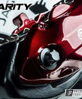 Front view of red automotive wheel component with high-gloss clear top coat; Prismatic Powders Clear Vision branding visible.