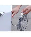 Heavy Duty Car Door Edge Guard Strip For Tesla Cybertruck Exterior Protection in chrome, being installed near door.