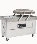 Dual Chamber Food Vacuum Sealer, Stainless Steel Double Chamber Packaging System with open lid and digital controls.
