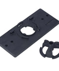 Black plastic hinge jig base plate with 35mm guide hole and removable clamp; base plate and clamp for woodworking.
