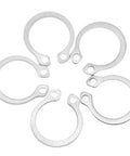 Close-up of stainless steel snap rings from Stainless Steel Retaining Ring Set 120Pc Kit Snap Ring Circlip Assortment 9Mm To 14Mm.