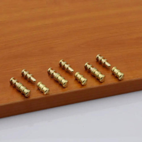 Zinc alloy table connector pins on wooden surface, 30x8mm, for snug extension leaf alignment, Upgrade Your Setup With This Set Of Fifteen Zinc Alloy Table Connector Pins And Copper Plated Sleeves Designed For Snug Extension Leaf Alignment And Keeps Your Dining Table Rock Steady Daily.