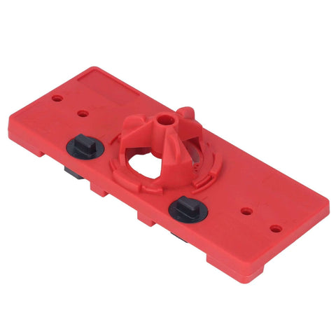 Red woodworking hinge drilling jig with 35mm hole guide and two black adjustment knobs.