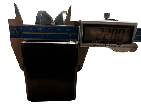 Measurement of cast iron v-groove gate wheel with digital caliper showing dimensions.
