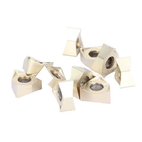 Front view: 10 gold-coated carbide inserts with central mounting holes for lathe turning