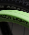 Close-up of green Air Liner Light XC Trail Mountain Bike Tire Insert for 29x2.1 to 2.4 inch tires showing branding.