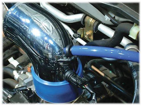 Spectre Performance 8711 vacuum sensor adapter kit installed in engine bay; blue silicone hose with black adapter.