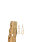 Plastic White Square Clock Hands With 1-3/8 Inch Minute Hole And Center Axis A-13 Replacement Parts next to ruler