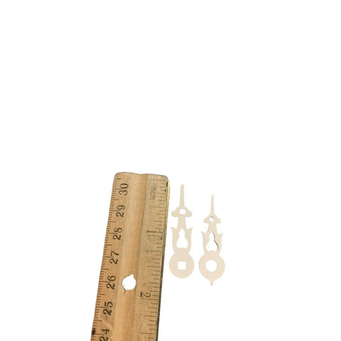Plastic White Square Clock Hands With 1-3/8 Inch Minute Hole And Center Axis A-13 Replacement Parts next to ruler