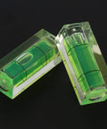 Ycauty 5PCS Small Bubble Level 15*15*40MM Mini Square Spirit Level Picture showing two clear acrylic bubble levels with green liquid.