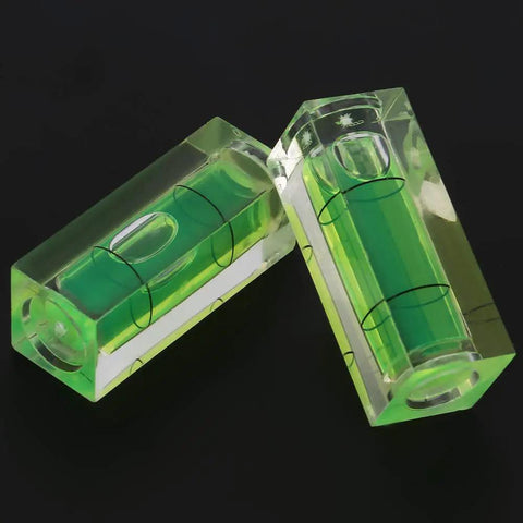 Ycauty 5PCS Small Bubble Level 15*15*40MM Mini Square Spirit Level Picture showing two clear acrylic bubble levels with green liquid.