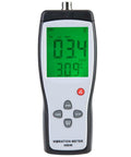 Professional Lcd Vibration Analyzer Meter displaying readings in green, compact for quick motor testing in a workshop.