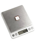 Drone GPS Module With M10 GNSS And QMC5883 Compass Ceramic Antenna on digital scale displaying 42.9 grams