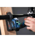 Professional 18V Brushless Hammer Drill Driver Kit With 8 Ah Battery Pack And 1330 Inch Pound Torque in use on wooden beam.