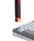 Two In One DIY Keyboard Tool With Switch Puller And Keycap Puller In Red For Easy Switch Removal And Keycap Lifting Rectangular Design With PC Housing, pulling a keycap