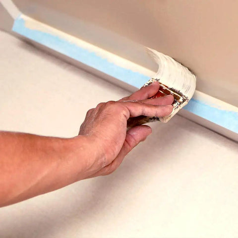Hand painting wall edge with brush above Heavyweight Canvas Drop Cloth 4 Ft By 5 Ft 10 Oz Contractor Grade, Washable And Reusable.